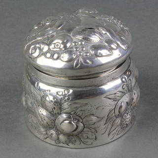 A Continental repousse silver trinket box with cavorting cherubs and fruit 3", 120 grams