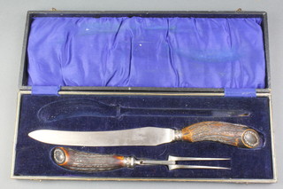 A cased silver mounted horn handled carving set 