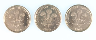 A 9ct gold 1969 Prince of Wales Investiture commemorative crown, 5.8 grams, 2 1969 Man First Sets Foot On The Moon commemorative crown 5.3 grams each   