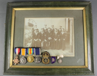 A World War One group to 291677 G. Brumham. R.N. comprising 1914-15 Star, British War medal, Victory medal and Naval Long Service and Good Conduct medal together with a bullion work badge and a silver George Prince of Wales medal an associated lapel pin and a framed photograph 