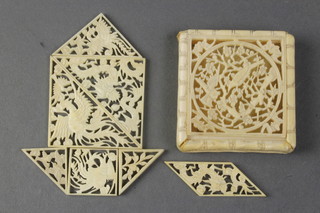 A carved Cantonese ivory box with pierced lid decorated birds amongst flowers enclosing puzzle pieces 2" 
