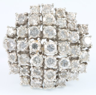 A 1970's 18ct white gold diamond set high mount 41 stone ring, size N 1/2 