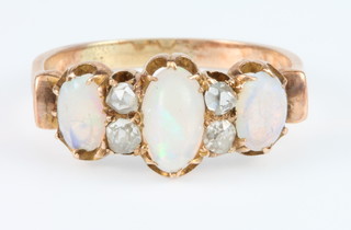 A Victorian gold 3 stone opal and 4 stone diamond ring size N 1/2