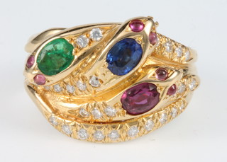 An 18ct yellow gold ruby, emerald, sapphire and diamond set serpent ring, size Q