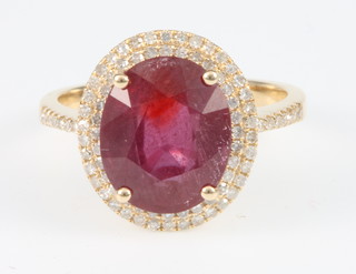 A 14ct yellow gold ruby and diamond cluster ring, size M 1/2 