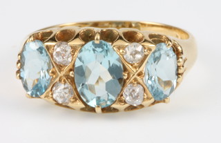 A yellow gold aquamarine and diamond ring size L 