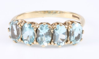 A 9ct gold 5 stone aquamarine ring, size M 