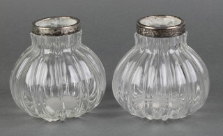 A pair of globular ribbed glass vases with silver rims 3" 