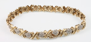 A 9ct yellow gold diamond set bracelet 7" 