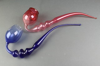A Victorian blue glass novelty pipe and a ruby glass ditto 12" 