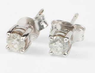 A pair of white gold single stone diamond ear studs 