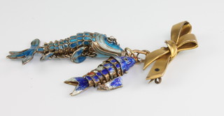 2 enamelled articulated fish suspended from a ribbon brooch