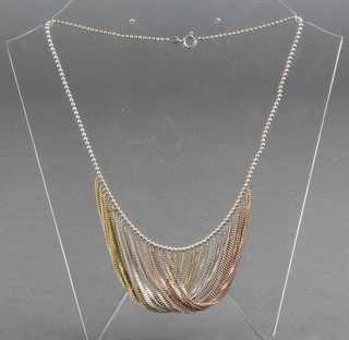 A silver and gold coloured multi chain link necklace