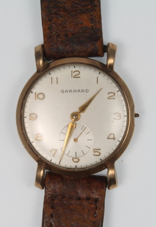 A gentleman's 9ct gold Garrard wristwatch with seconds at 6 o'clock and presentation inscription 
