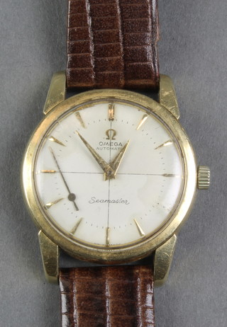 A gentleman's gilt cased Omega automatic Seamaster wristwatch on a leather strap 