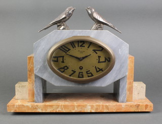A French Art Deco 8 day timepiece with oval gilt dial and Arabic numerals marked Maquer Lens, contained in a grey and pink marble case surmounted by 2 figures of birds 