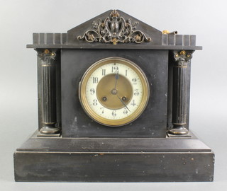 A French 19th Century 8 day striking mantel clock with enamelled dial and Arabic numerals contained in a black marble architectural case 15"h 