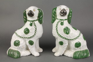 An unusual pair of 19th Century green and white Staffordshire figures of standing Spaniels 8 1/2" 