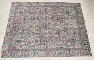 A Persian Tabriz white and blue ground carpet 112" x 85"  