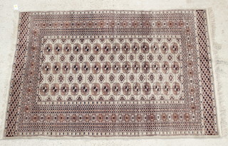 A Bokhara brown ground rug with 42 octagons to the centre 72" x 50"  