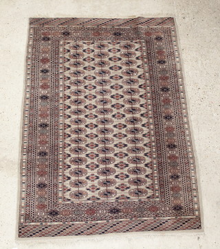 A Bokhara brown ground rug with 48 octagons to the centre 71" x 51"   