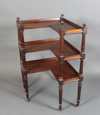 A Victorian mahogany 3 tier corner what-not with three-quarter gallery, raised on turned supports with brass caps and casters 41"h x 25 1/2"w x 26"d