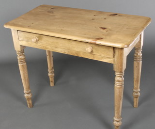 A Victorian pine side table fitted a drawer with tore handles, raised on ring turned supports 28 1/2"h x 36"w x 20"d 