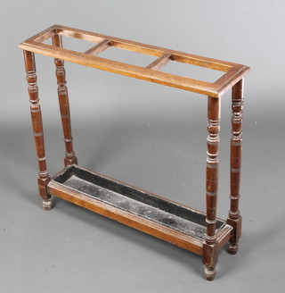 An Edwardian rectangular walnut umbrella stand, raised on turned supports complete with drip tray, 26"h x 28"w x 27"d 