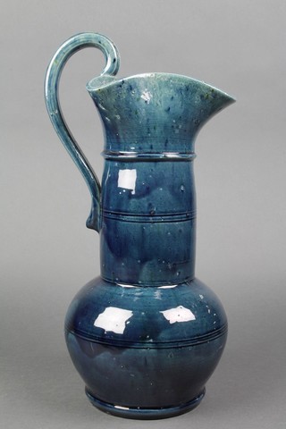 A blue glazed Art Pottery jug 13", slight chip to rim 