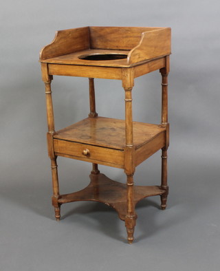 A Georgian mahogany wash stand with three-quarter gallery and bowl receptacle, the base fitted a drawer with undertier, raised on turned and block supports 37"h x 18"w x 16"d 