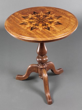 A Victorian circular mahogany wine table, the top inlaid stylised star with specimen marquetry, raised on a turned column and tripod base 26"h x 22" diam. 