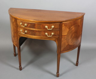 A Georgian style mahogany demi-lune sideboard fitted 2 long drawers flanked by a pair of cupboards, raised on square tapering supports ending in spade feet 36"h x 48"w x 21"d 
