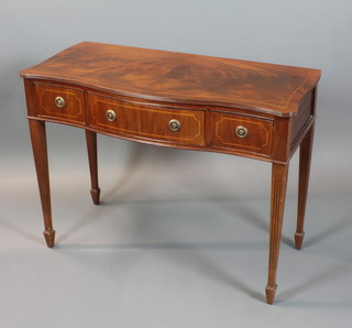A pair of Georgian style mahogany cutlery/side tables of serpentine outline, the top inlaid satinwood stringing, fitted 1 long and 2 short drawers, raised on square fluted tapered supports 30"h x 41"w x 18"d