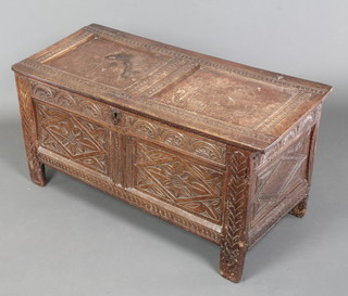 An 18th Century oak coffer of panelled construction with hinged lid 19"h x 39 1/2"w x 18"d 