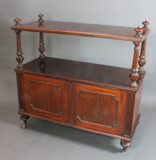 A Victorian mahogany buffet fitted a cupboard, raised on a turned column and bun feet 48"h x 52"w x 21"w 