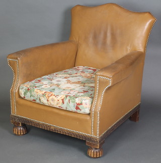 An Art Deco armchair upholstered in leather 