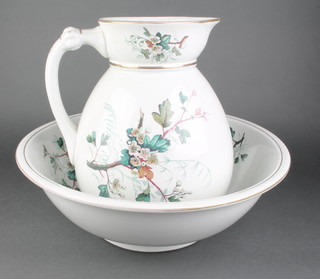 A Victorian pottery jug and bowl set with floral decoration