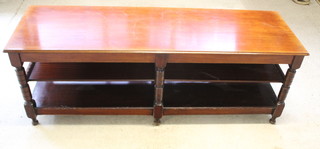 An Edwardian rectangular mahogany 2 tier library table/shopfitting, raised on 6 turned and block supports with later added under tier 34"h x 96"w x 31 1/2" 