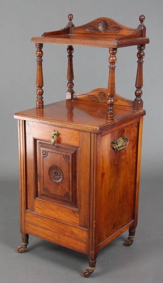 A Victorian walnut 2 tier coal purdonium enclosed by carved panelled doors with brass drop handles to the side 38"h x 15 1/2"w x 14"d 