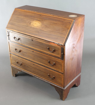 An Edwardian inlaid mahogany bureau, the fall front revealing a well fitted interior above 3 long drawers with brass swan neck drop handles 37"h x 36"w x 16"d 