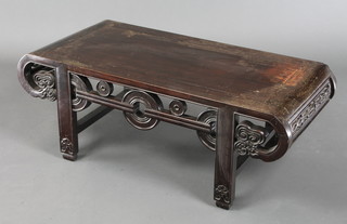A Chinese Padouk wood rectangular table, raised on square supports with shaped stretcher 13"h x 34 1/2"w x 16 1/2"d 