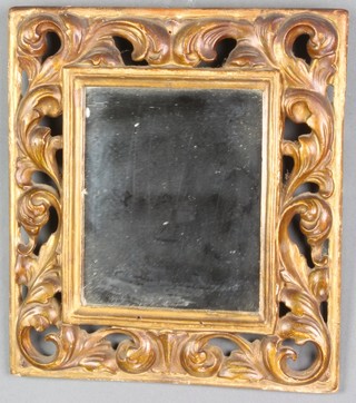 A plate wall mirror contained in a decorative carved and pierced hardwood frame 10" x 9" together with a Victorian black lacquered chinoiserie style wall pocket decorated court figures 9"h x 9"w x 2 1/2"d