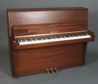 Welmar, an upright iron framed overstrung piano forte, model 109290 contained in a mahogany finished case  45"h x 56"w x 23"d 