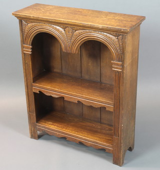 A carved oak bookcase with arcaded and column decoration 36"h x 30"w x 10"d 