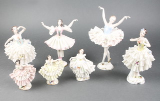 7 Continental porcelain figures of ballerinas with crinoline dresses, a 19th Century Staffordshire flatback figure group of 2 standing girls 5 1/2" and a Continental porcelain figure of a standing gallant 6" 