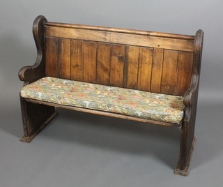 A pine pew/bench complete with squab 33"h x 47"w x 16"d 
