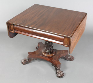 A Victorian mahogany pedestal sofa table fitted a frieze drawer and raised on turned column and triform base with paw feet 28"h x 30" when closed x 49" when open x 26"w 
