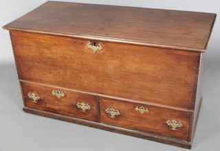 An 18th Century walnut mule chest with hinged lid, brass escutcheons and plate drop handles 28"h x 50"w x 24"d 