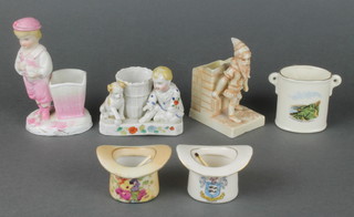 A 19th Century German bisque match holder in the form of a boy and a puppy sitting by a basket 4", 5 other match holders