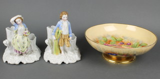 An Aynsley circular bowl decorated fruit raised on a circular spreading foot, painted by M Brunt 10" together with a pair of 19th Century biscuit porcelain spill vases decorated figures depicting the harvest 7" 
